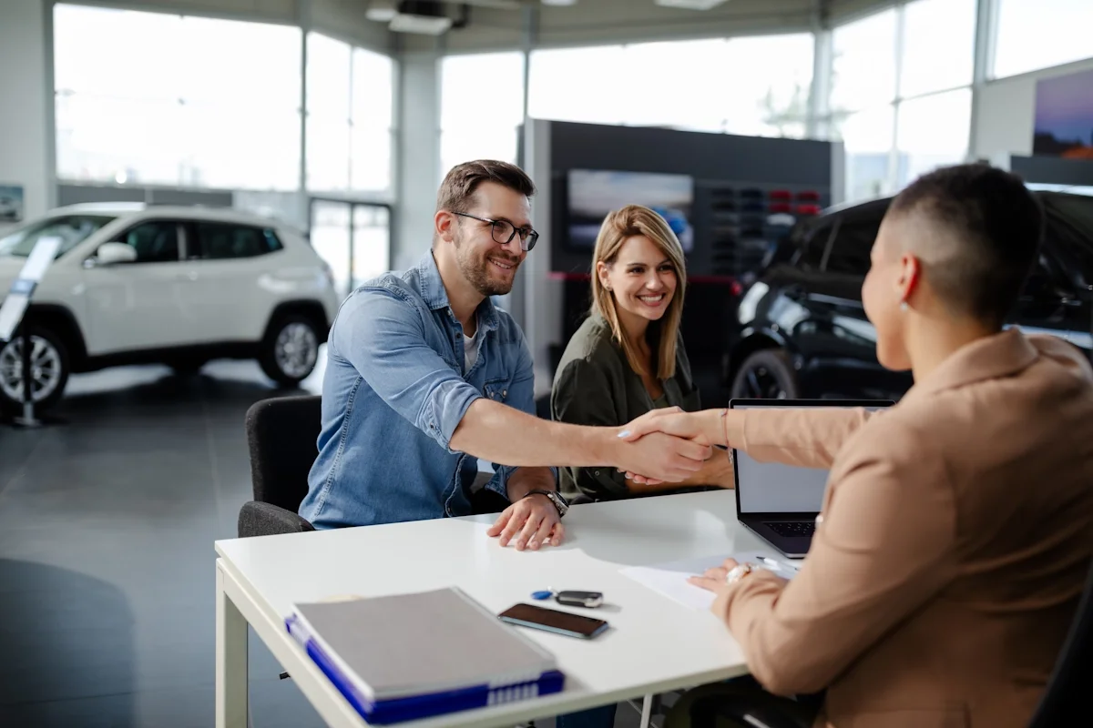 People at dealership table